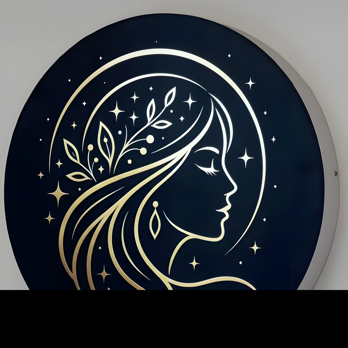 The Aura Luxe logo sign: a gold line drawing of a woman in profile on a navy roundel