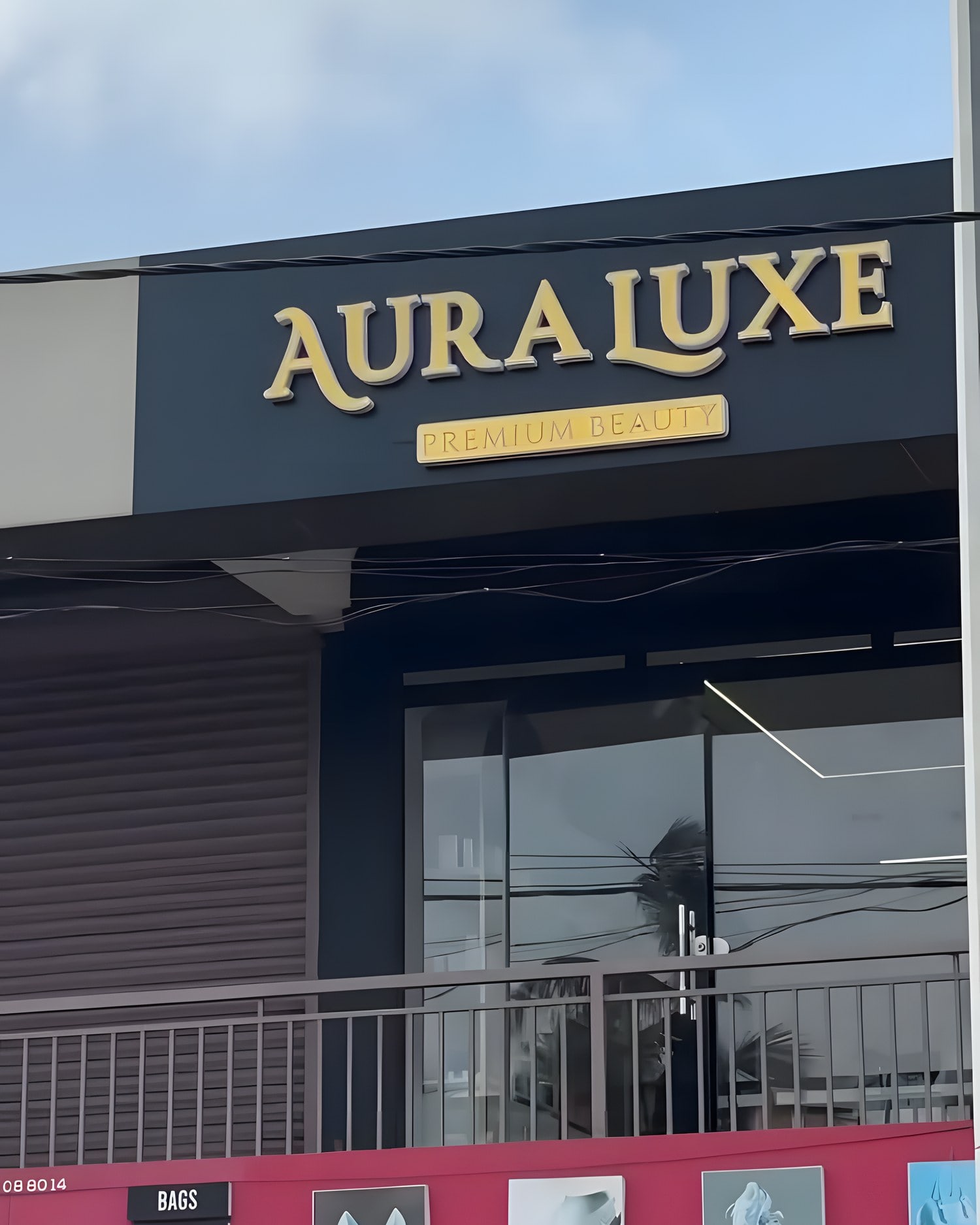 The Aura Luxe storefront: gold AURA LUXE, PREMIUM BEAUTY lettering on a dark fascia